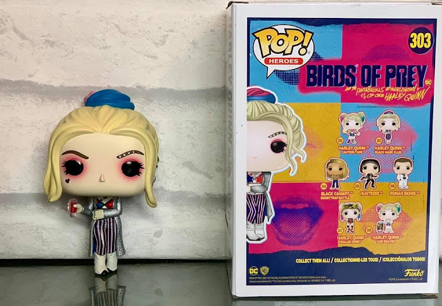 Harley Quinn Funko Pop! Heroes Black Mask Club Vinyl figure from birds of Prey with box Harley Quinn Funko Pop! Heroes figure next to box with other birds of prey characters